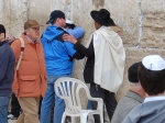 Kelley being prayed over at the Wailing Wall Jerusalem